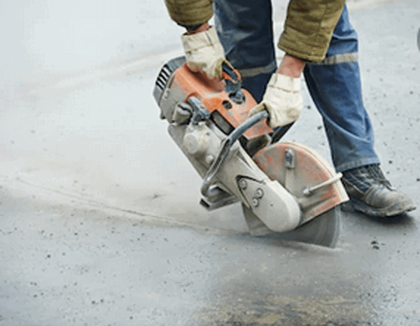 circular saw cutting asphalt pavement