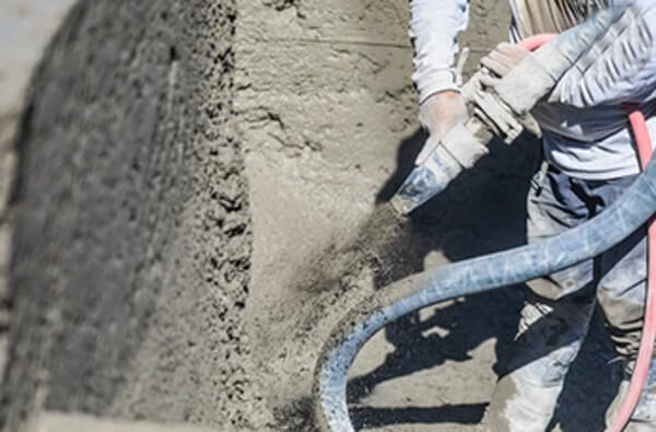 does gunite have to be dry before spraying pebble finish