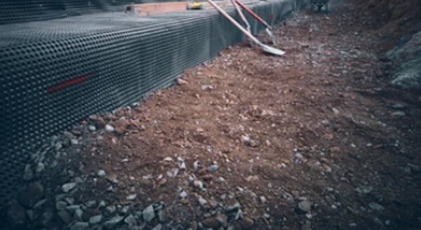 What do you backfill a trench with