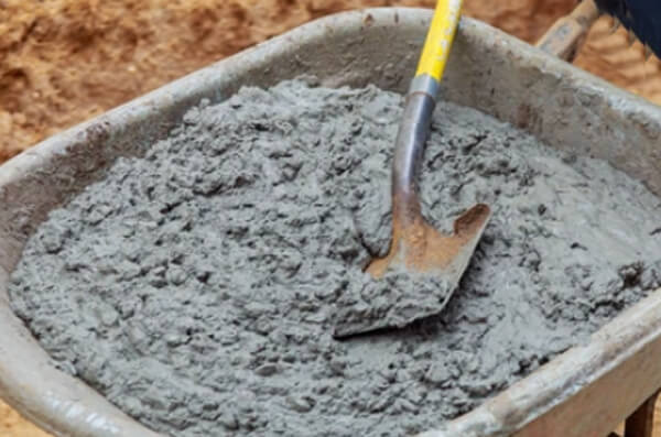 Mix concrete in a wheelbarrow